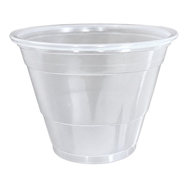 A clear, squat plastic cup with a wide rim and slightly tapered sides.
