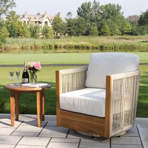 Outdoor Interiors Speckled Cable Wicker and Teak Swivel Chair with Acrylic Fabric Cushions