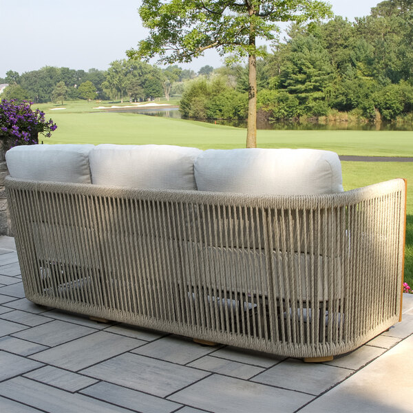 Outdoor Interiors Speckled Cable Wicker and Teak Sofa with Acrylic Fabric Cushions