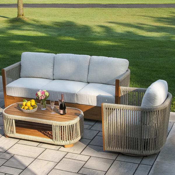 Outdoor Interiors Speckled Cable Wicker and Teak Sofa with Acrylic Fabric Cushions