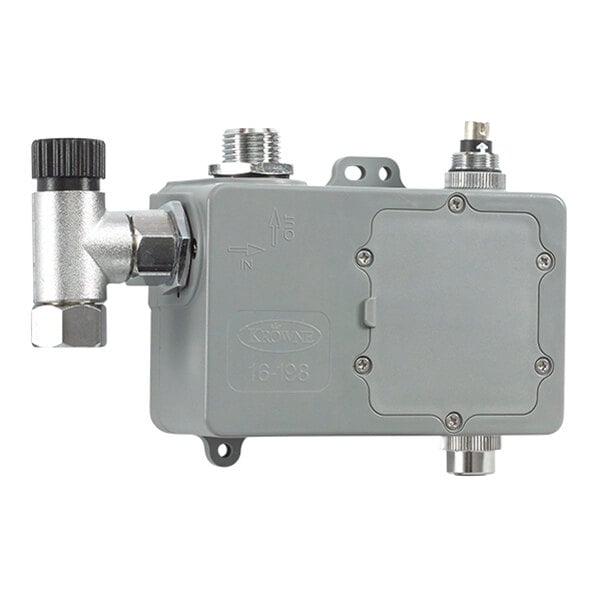 A rectangular metallic control module with multiple connectors and a valve attachment, featuring a screw-fastened cover and labeled markings.