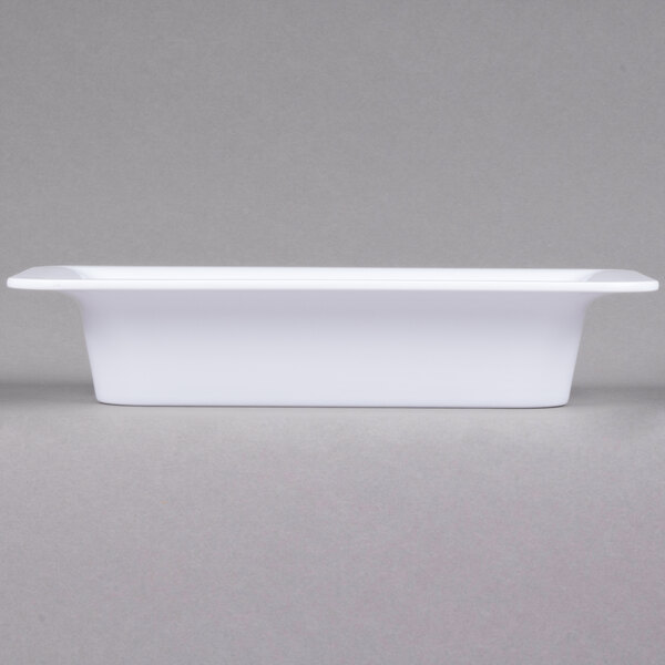 A white rectangular Carlisle food pan with a lid.