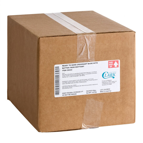 A brown cardboard box sealed with clear tape, featuring a white product label on the front.