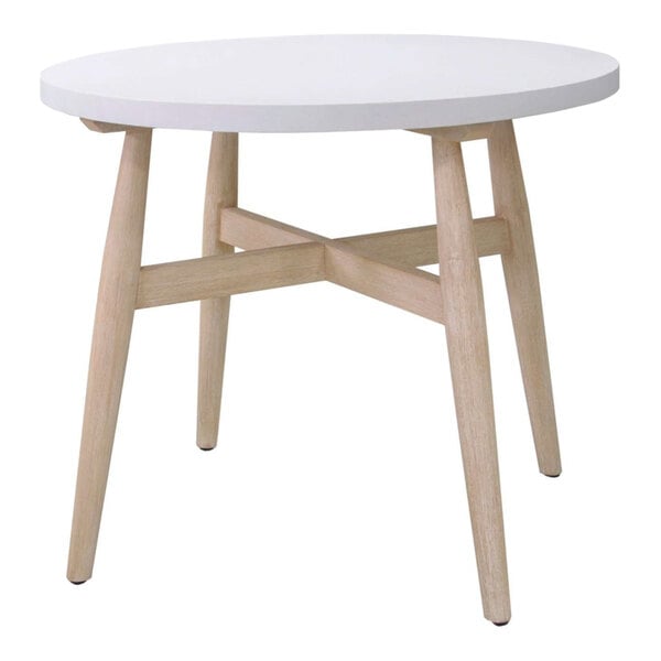 A round table with a white top and light wood legs featuring a cross-brace design.