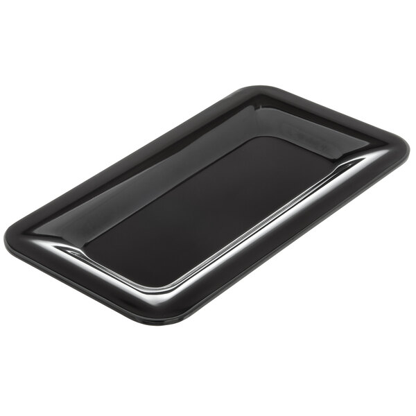 A black rectangular Carlisle food pan on a counter.