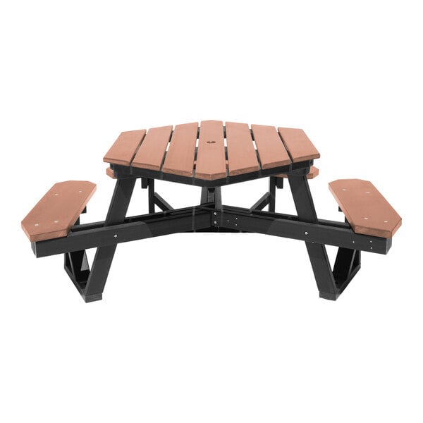 A brown and black picnic table with a hexagonal top and attached benches, made from slatted material.