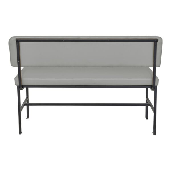 A gray upholstered bench with a backrest, supported by a black metal frame, viewed from the rear.