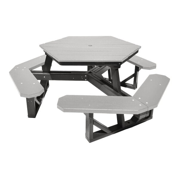 A hexagonal picnic table with attached benches, made of gray and black materials.
