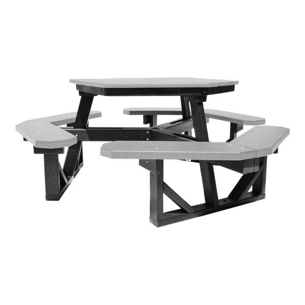 A hexagonal picnic table with attached benches, featuring a gray tabletop and seats with black supporting legs and frame.