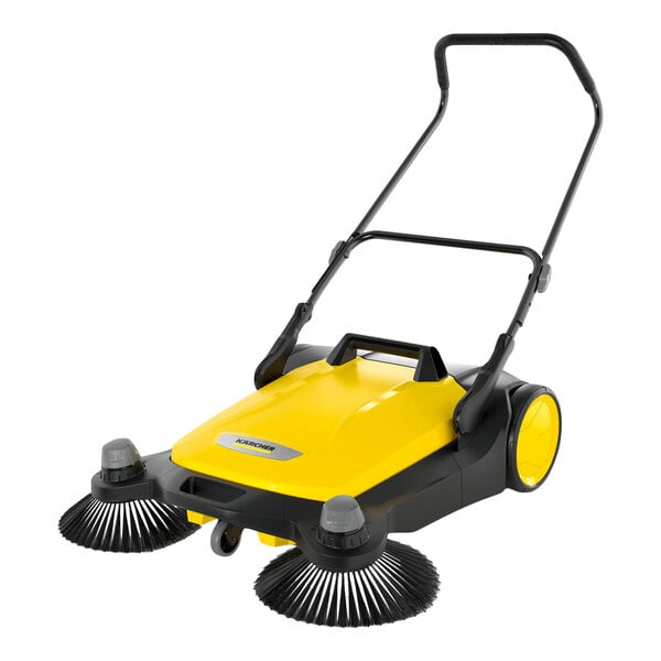 A yellow and black manual sweeper with two large side brushes, a handle, and two rear wheels.