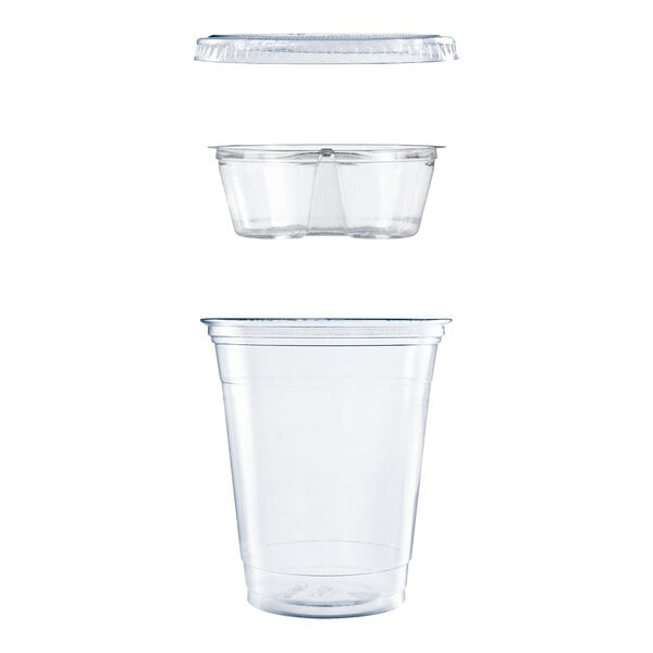 A clear plastic cup kit shown disassembled, including a main cup, a dual-compartment insert, and a flat lid.