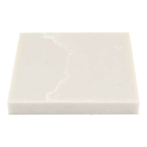 A close-up view of a square, light gray, stone-like sample with subtle white veining.