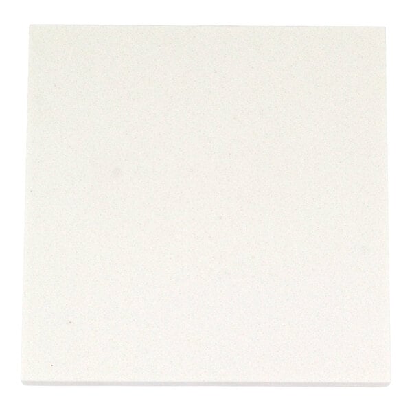A close-up view of a square, smooth, white surface with a subtle speckled pattern.