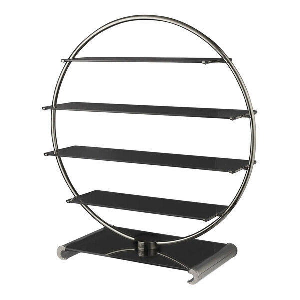 A circular metal display stand with four black glass shelves and a sturdy base.