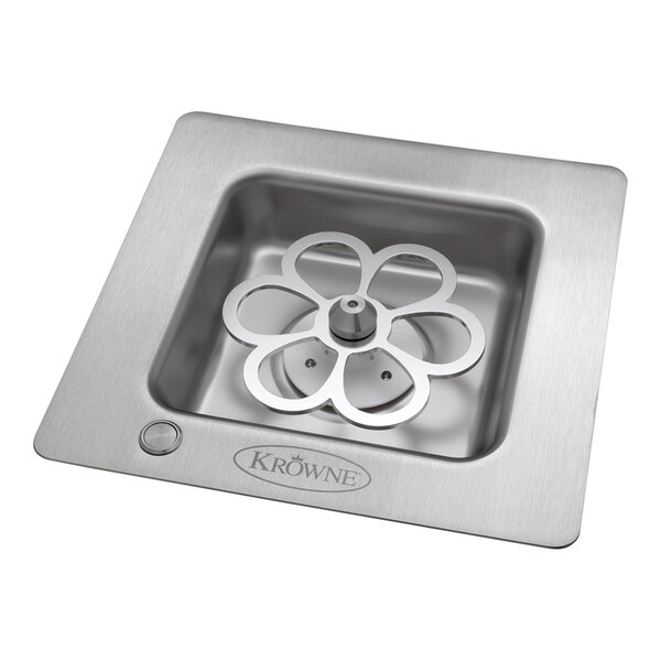 A stainless steel square drop-in unit with a flower-shaped metal component in the center, designed for chilling glasses.