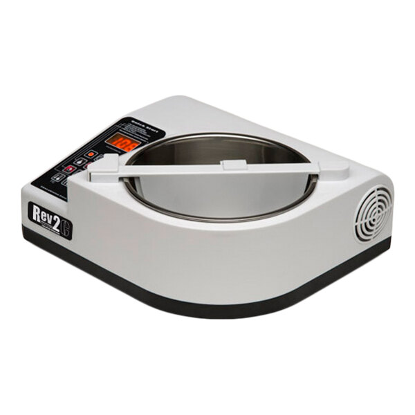 A white and black countertop machine with a digital display, control buttons, and a round metal bowl in the center.