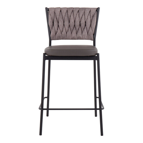 A counter-height stool with a black metal frame, a light brown braided fabric backrest, and a cushioned faux leather seat.