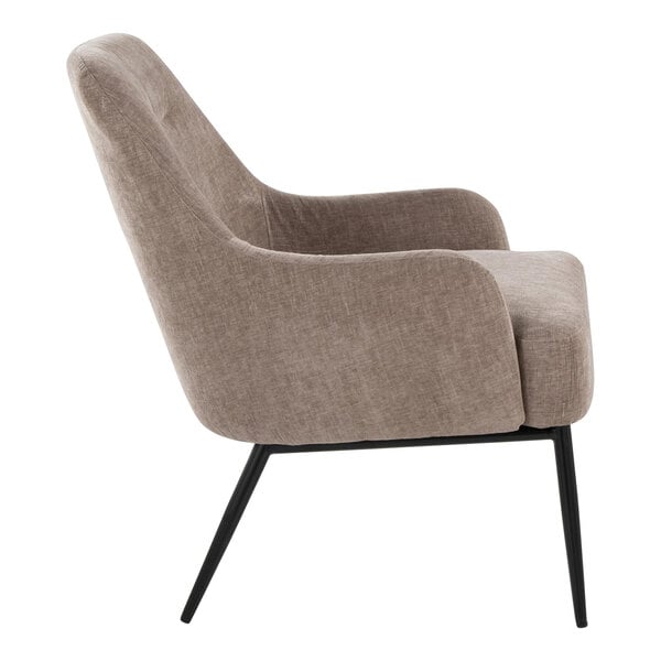 A side view of a modern chair with light brown fabric upholstery and black metal legs.