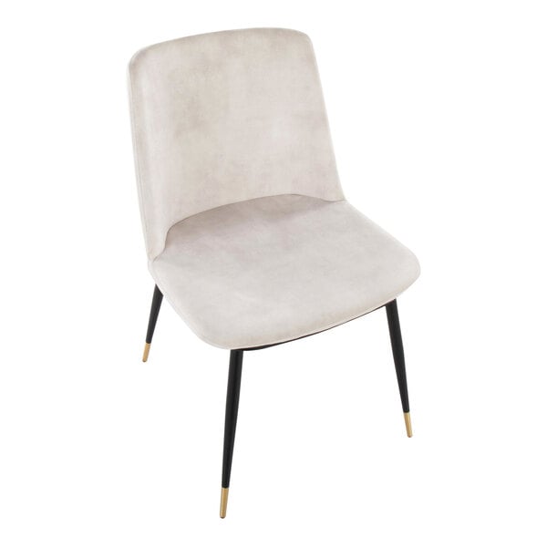 A modern chair with a beige velvet-like upholstered seat and back, featuring black metal legs with gold-colored tips.