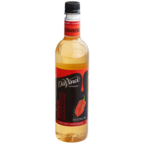 A clear bottle with a black and red label featuring a habanero pepper image, containing a light amber liquid and topped with a black cap.