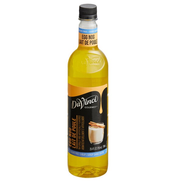 A clear bottle with yellow liquid and a black label featuring the DaVinci Gourmet brand and an image of a glass of eggnog with cinnamon sticks.