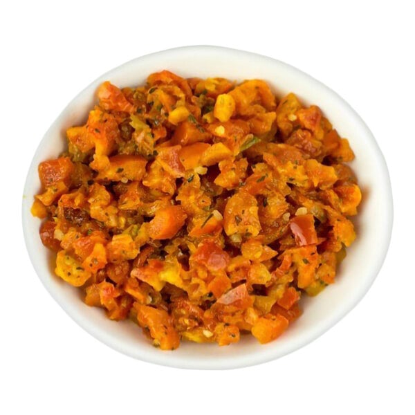 A white bowl filled with a chunky, orange-red mixture that appears to be a seasoned vegetable or tomato-based topping.