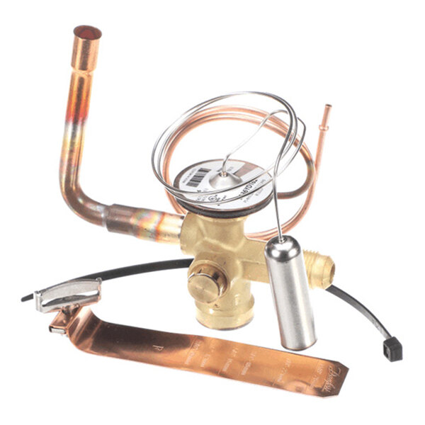 A brass and copper mechanical valve assembly with attached tubing and a cylindrical metal component, likely part of a refrigeration or HVAC system.
