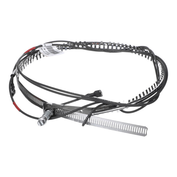 A coiled metal strip with attached wires and a small metal fitting, likely part of an electrical or mechanical assembly.
