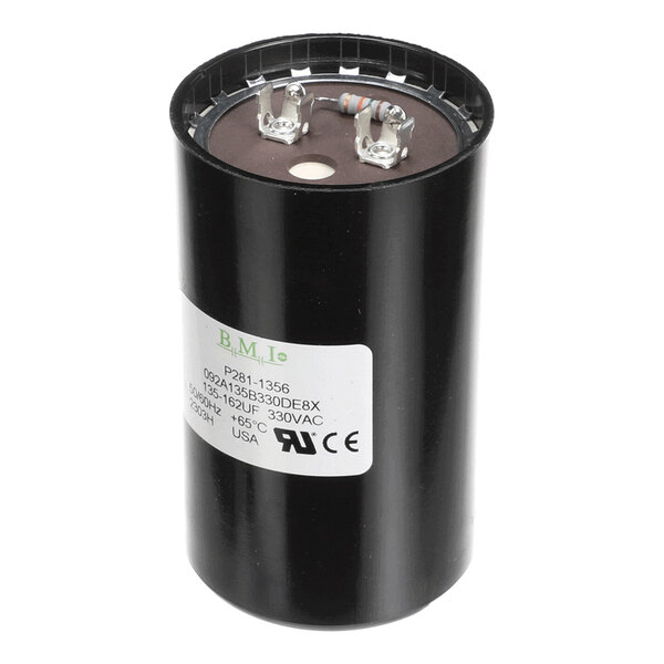 A cylindrical black capacitor with two metal terminals and a resistor on top, featuring a white label with technical specifications.