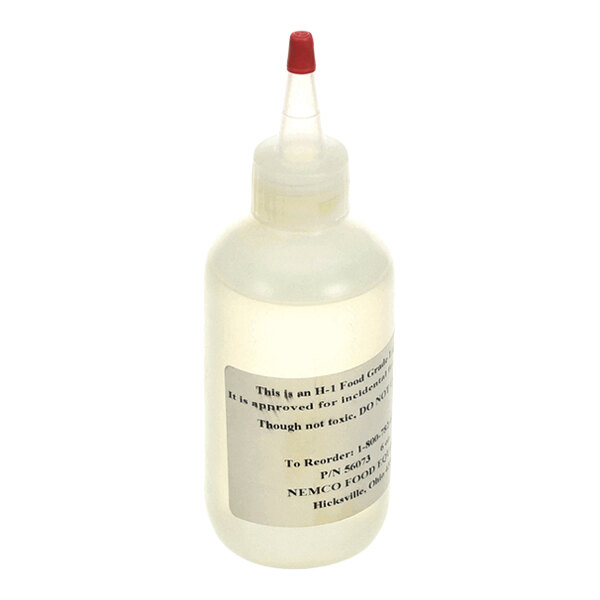 A clear plastic squeeze bottle with a pointed nozzle and a red cap, featuring a white label with text.