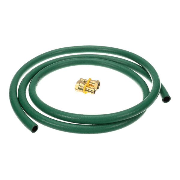 A coiled green hose with a brass fitting placed in the center.