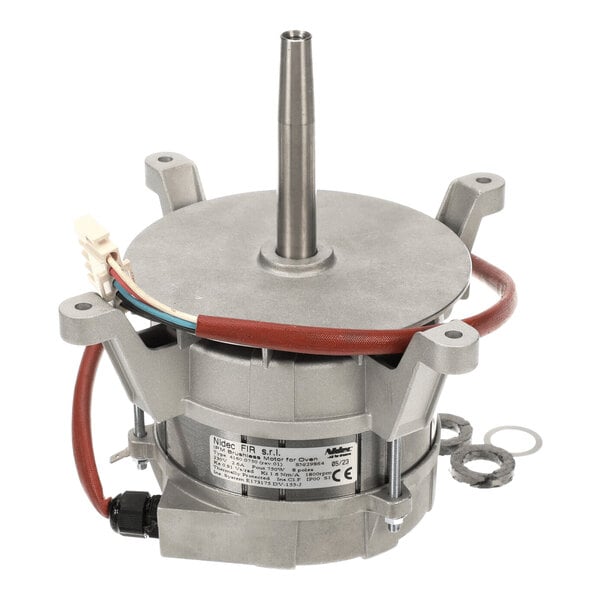A metallic motor assembly with a central shaft, attached wiring, and two washers placed beside it.