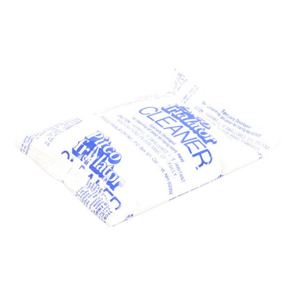 A small, rectangular white packet with blue text labeled 'Cleaner' and other product information.