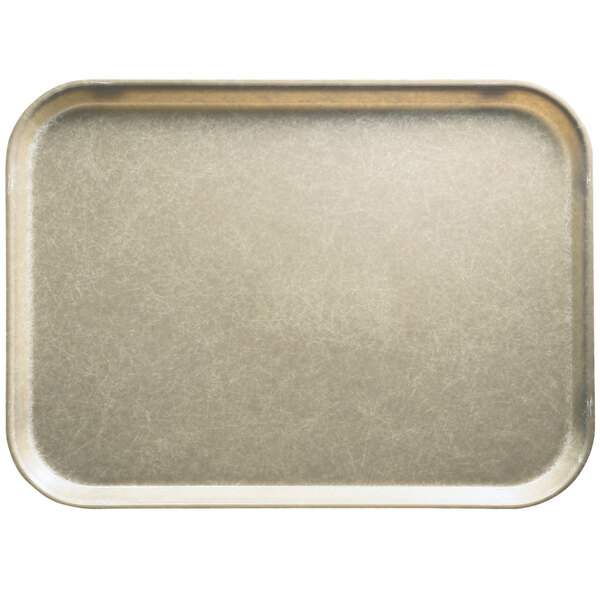 A rectangular desert tan fiberglass Camtray on a counter in a school kitchen.