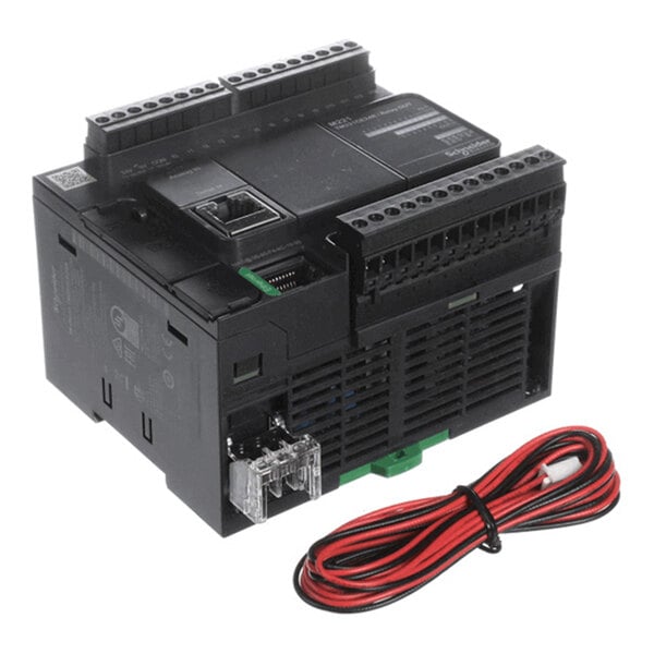 A black electronic device with multiple terminal connections and a red and black wire harness placed beside it.