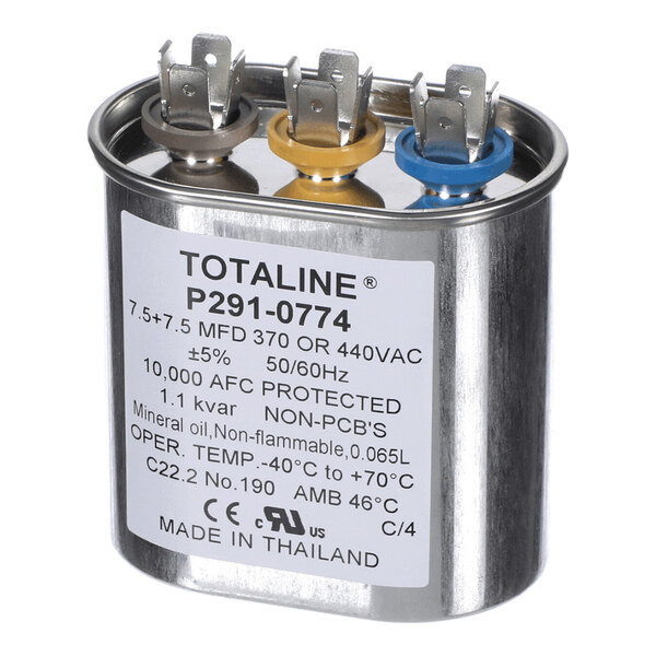 A metallic oval capacitor with three color-coded terminals (brown, yellow, and blue) and a label displaying technical specifications.