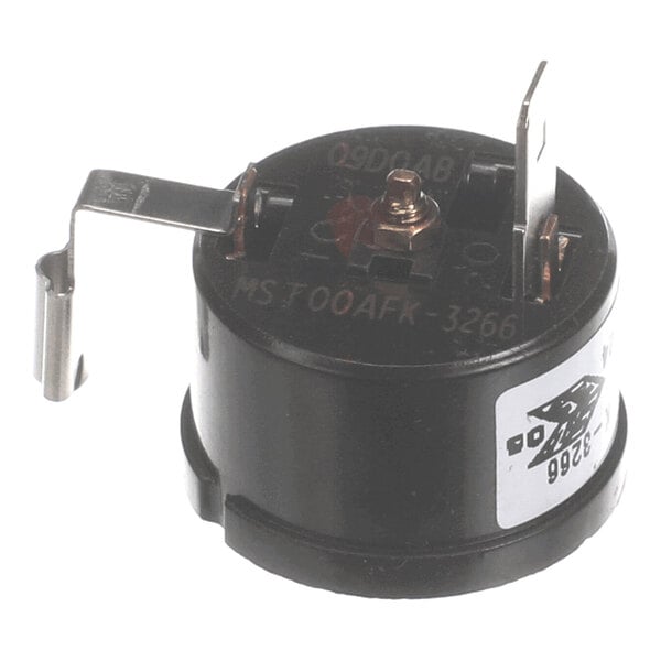A small, round black electrical component with metal terminals and a label on the side.