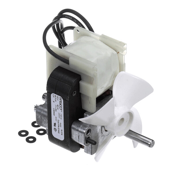 A small electric motor with a white plastic fan blade attached and several black washers nearby.