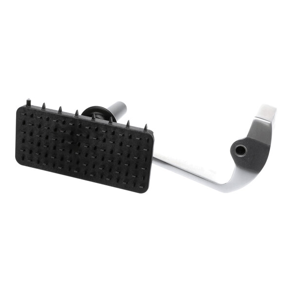 A metal and plastic component with a rectangular, spiked black pad and a curved metallic arm, likely part of a mechanical assembly.