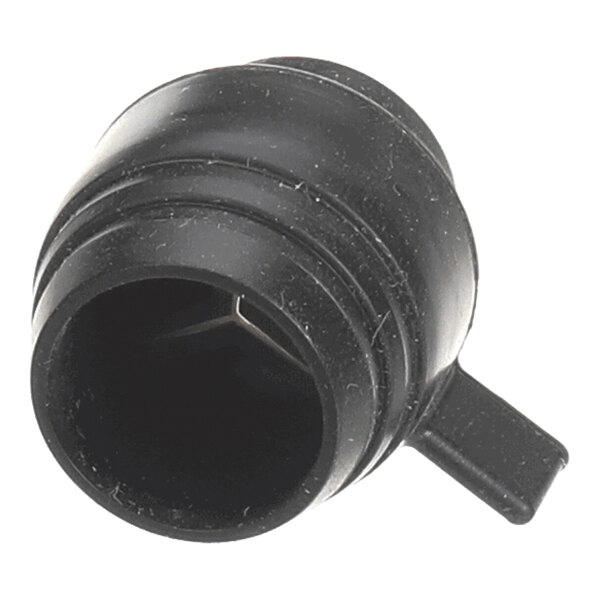 A black, cylindrical plastic nozzle with a side tab and internal cross supports.
