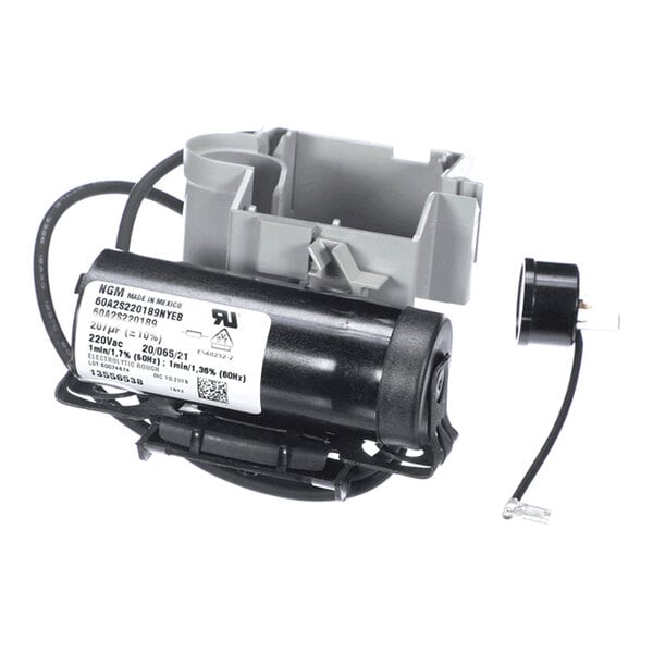 A black cylindrical electrical component with attached wires and a gray plastic mounting bracket, likely part of a starter kit for an appliance.