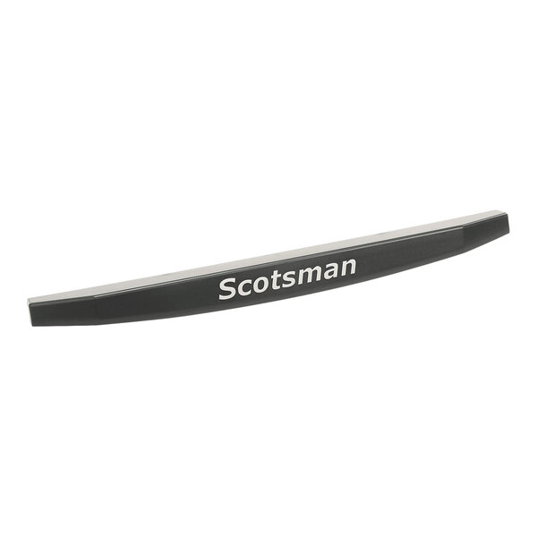 A black, slightly curved trim piece with the word 'Scotsman' printed on it in white letters.