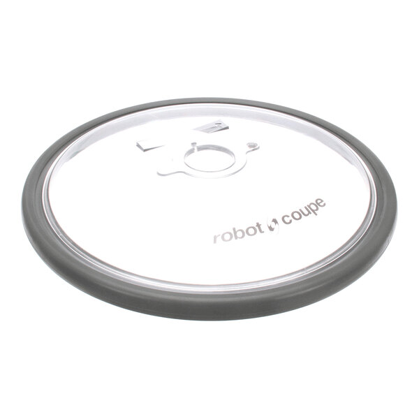A round, transparent lid with a gray rim and the words 'robot coupe' printed on it.
