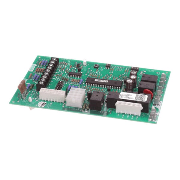 A green electronic circuit board with various components, connectors, and relays mounted on its surface.
