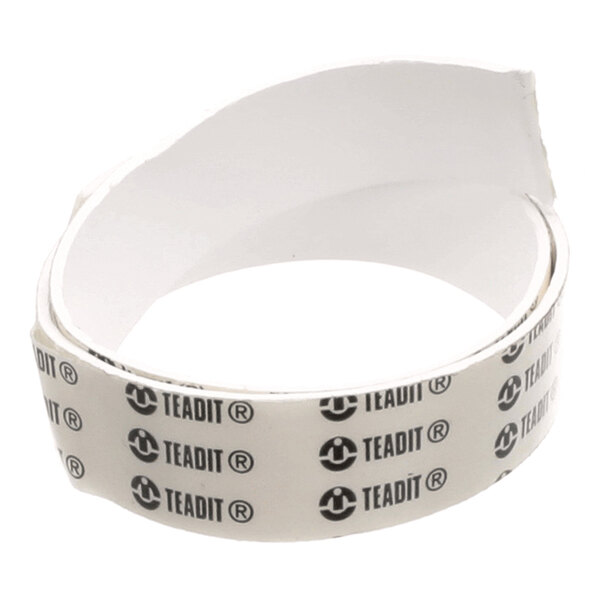 A coiled strip of white tape with black 'TEADIT' branding repeatedly printed on its surface.