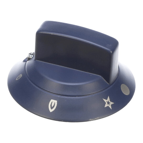 A dark-colored control knob with various symbols, including a star, a shield-like shape, and a circle, printed around its base.