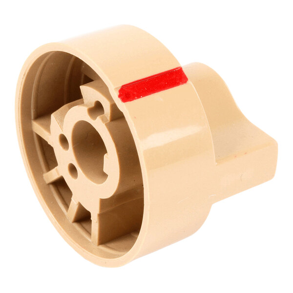 A beige plastic knob with a red marking and an open, structured interior.
