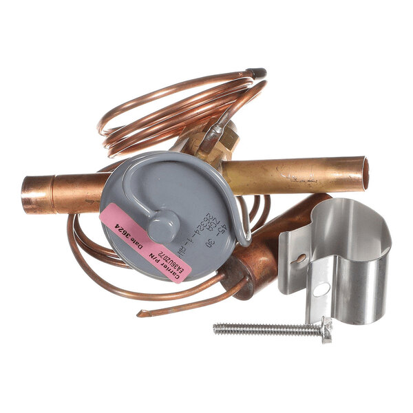 A metal valve assembly with copper tubing, a coiled copper wire, a gray circular component, a metal bracket, and a screw.