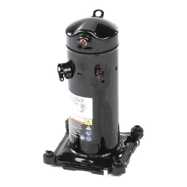 A black cylindrical metal component with several pipe connections and a mounting base, likely a compressor unit.