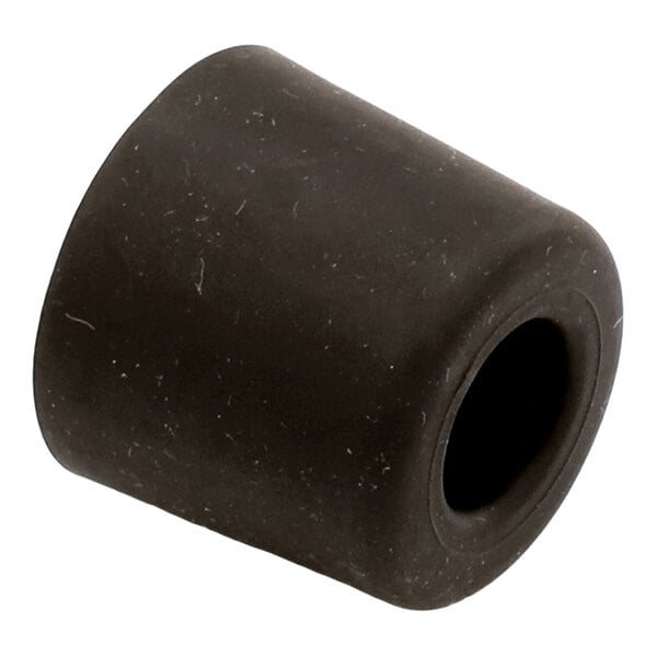 A black, cylindrical rubber or rubber-like object with a hollow center, resembling a protective foot or cap.